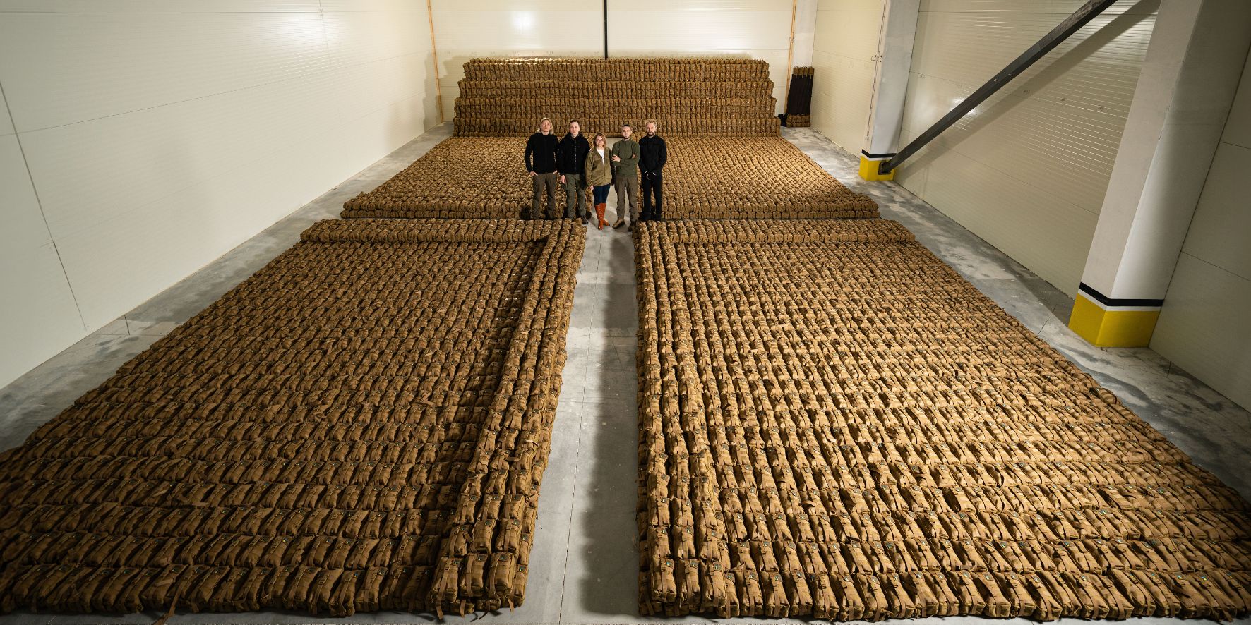 Warehouse full of First Aid Kits or IFAKs and United Help Ukraine Team Members