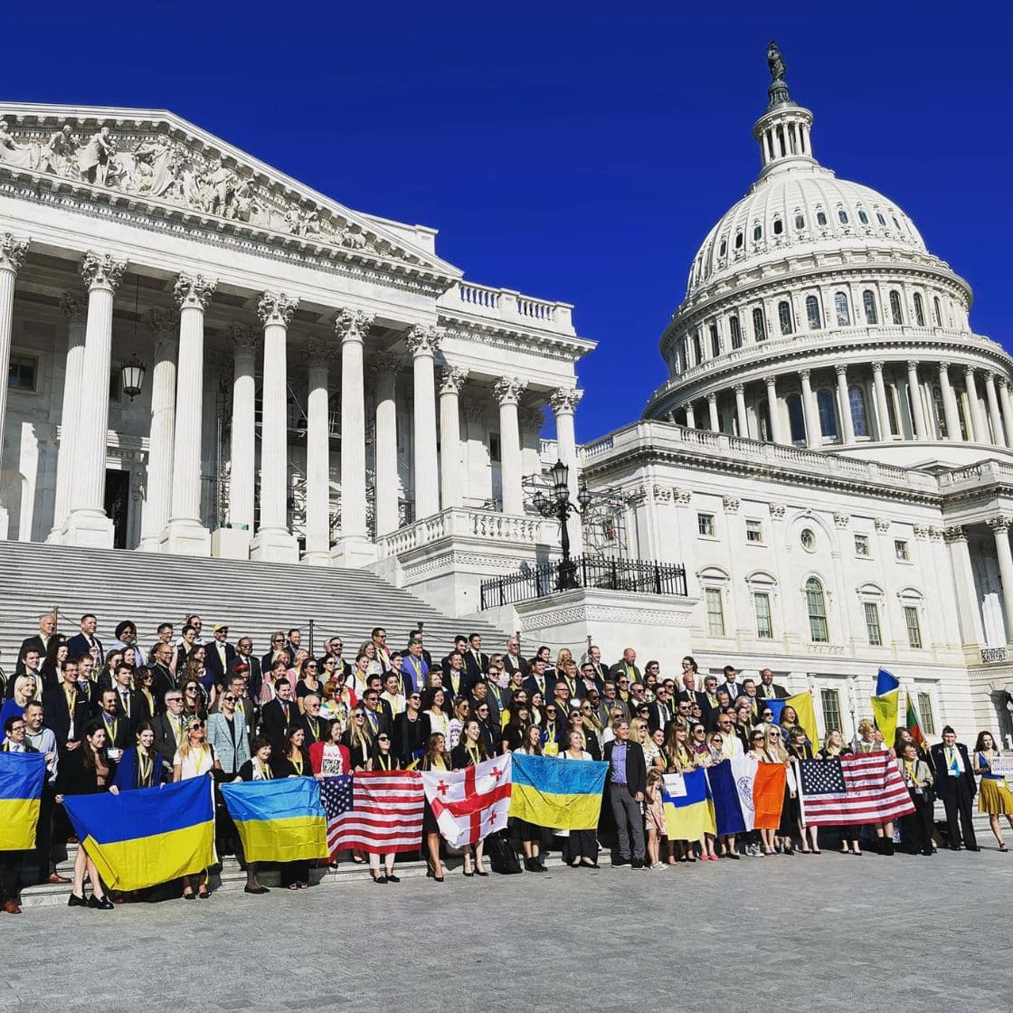 A lot of people in front of the Capitol building in Washington, they carry Ukrainian, American, Georgian flags to advocate for Ukraine.
